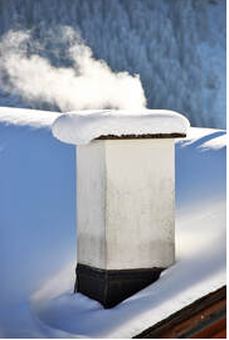 On a cold winter day in Sherbrooke, we see the smoke coming out of the chimney.